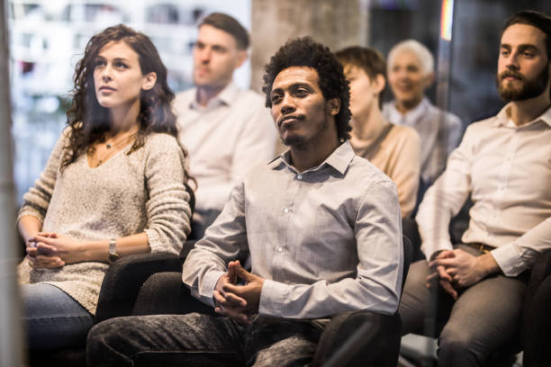 istock Large group of entrepreneurs attending a training class in a board room. 1139011613