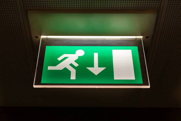 istock Close-up of green emergency exit light sign 1139012945