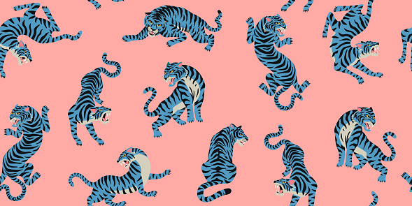 Vector seamless pattern with cute tigers on the pink background. Circus animal show. Fashionable fabric design.