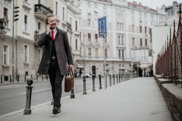 istock Young businessman using mobile phone on the street 1139013819