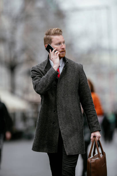 istock Young businessman using mobile phone on the street 1139014726