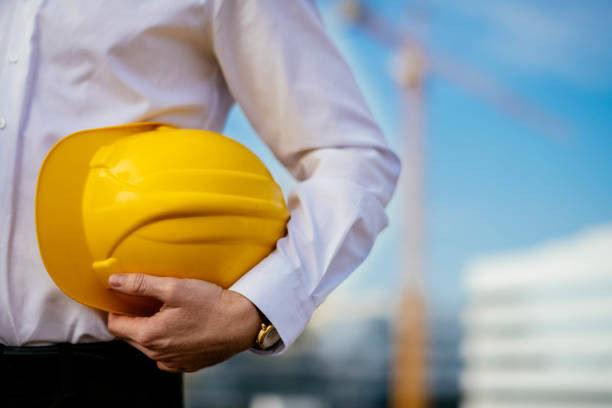 istock Young architect holding yellow helmet 1139019566