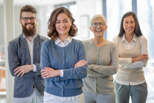 istock Group of multi generation business colleagues  in open hub office 1139021815
