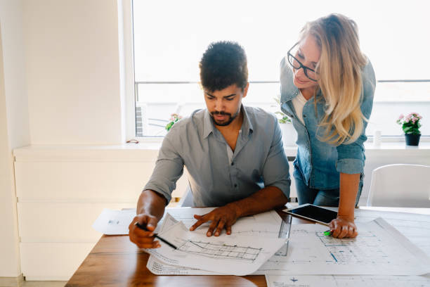 istock Coworkers working at business office and using tablet 1139022491
