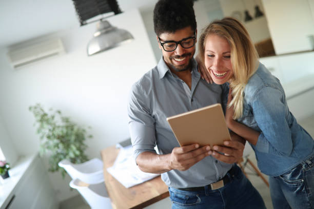 istock Happy couple in love surfing on tablet 1139022583