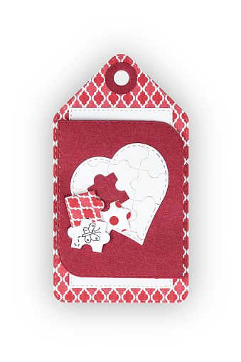 Handmade gift favor tag decorated with heart shape and puzzle pieces