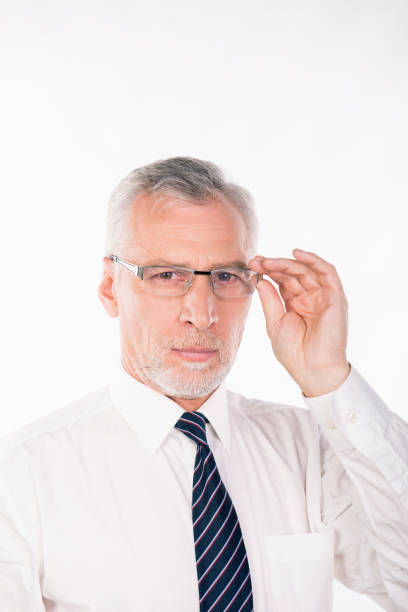 istock Old businessman holding his glasses 1139026492