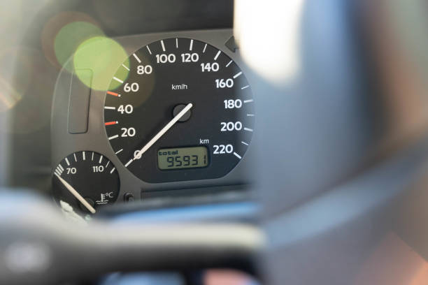 Tachometer Tachometer of a car seen through a steering wheel dashboard close up speedometer odometer stock pictures, royalty-free photos & images