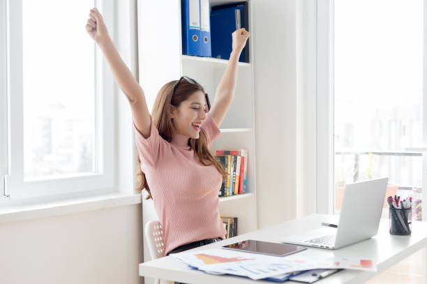 istock Happy excited woman at work 1139030393