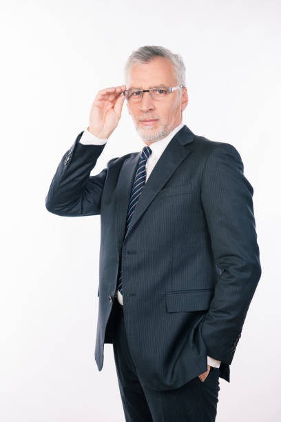 istock confident intelligent  businessman holding his glasses 1139031252