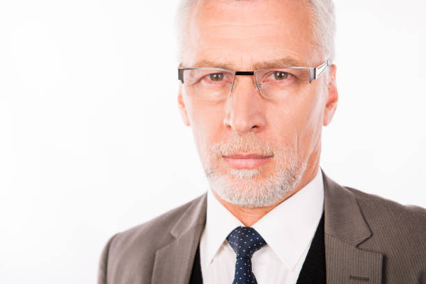 istock Old handsome businessman in an elegant suit with glasses 1139032170