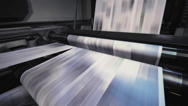 Process of cutting the printed sheets for the daily newspaper in the newspaper printing factory