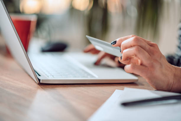 istock Woman shopping online and using credit card 1139034597