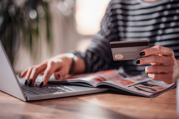 istock Woman shopping online and using credit card 1139034683