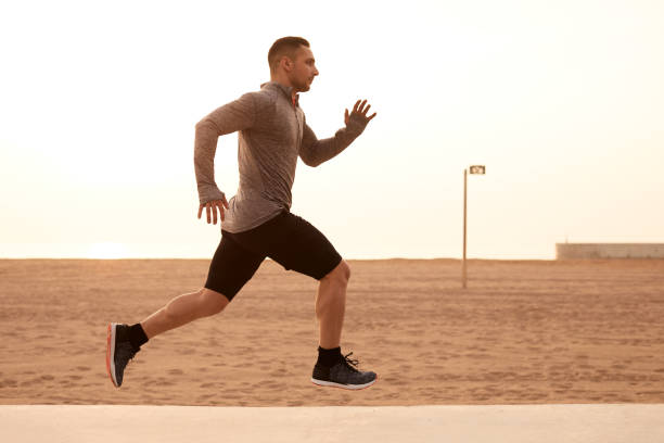 istock One man running exercising in Barcelona. 1139035998