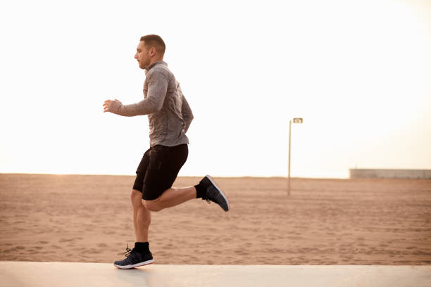 istock One man running exercising in Barcelona. 1139035999