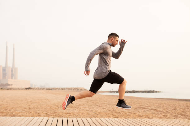 istock One man running exercising in Barcelona. 1139036019