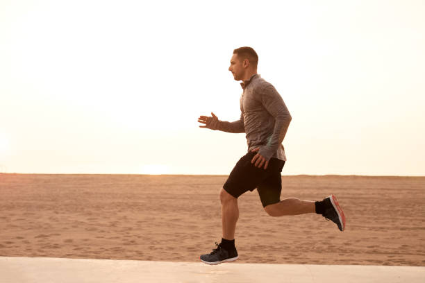 istock One man running exercising in Barcelona. 1139036025