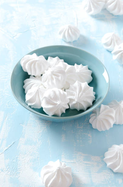 istock Vertical shot. Delicious crispy meringue in the plate on the blue table 1139037329