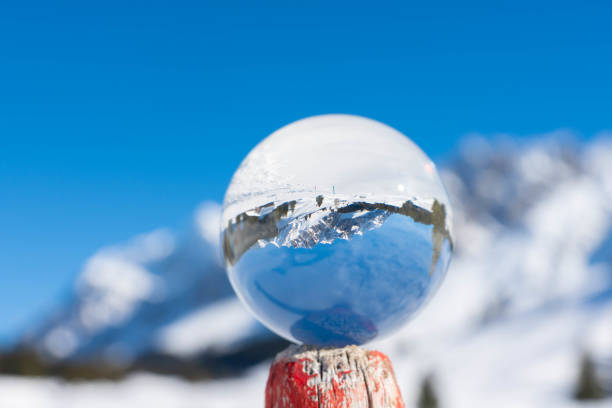 istock Winter mountains in a crystal ball 1139037362