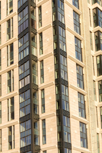 istock New high-rise building decorated with stone slabs with large Windows 1139040643