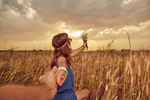 istock Young couple enjoying in a wheat field. 1139041092