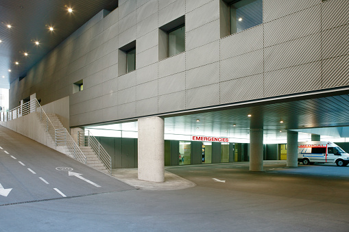 Hospital parking lot and emergencies entrance floor. Medical center building