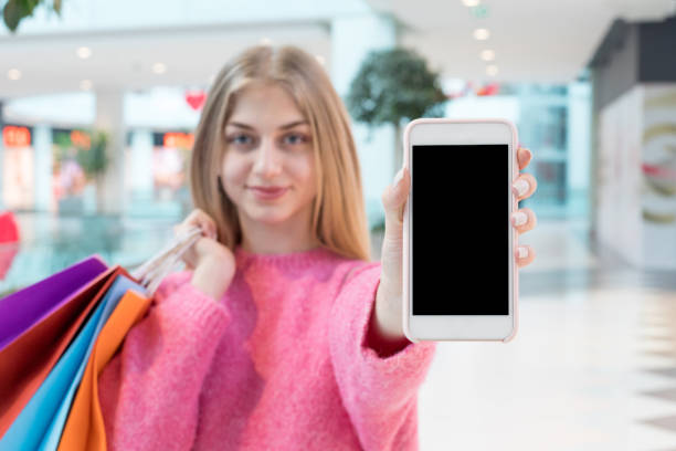 istock Showing blank phone screen in mall 1139043286