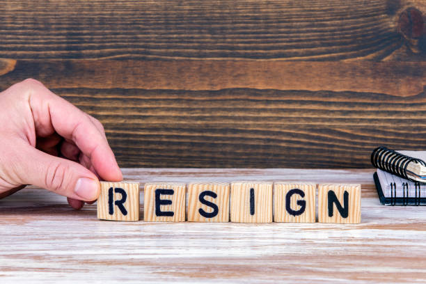 istock Resign. Wooden letters on the office desk 1139043904
