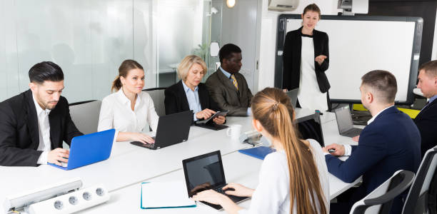 istock Smiling business female presenting business strategy  in office 1139044043