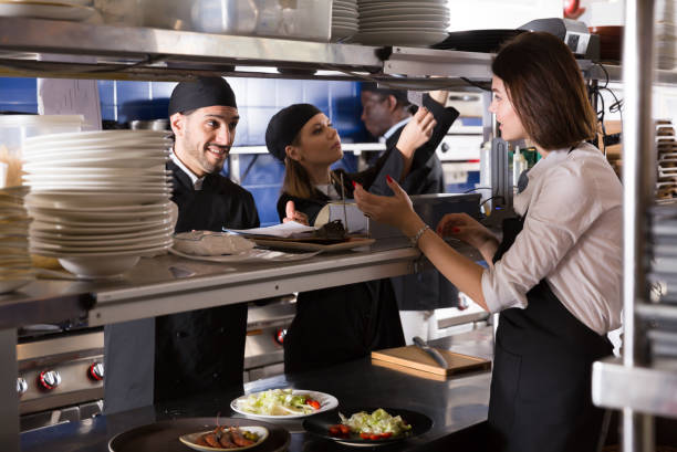 istock Young kitcheners are taking order from waiter 1139047189