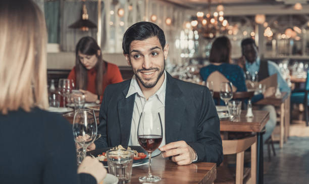 istock Cheerful man with female in restaurant 1139047219
