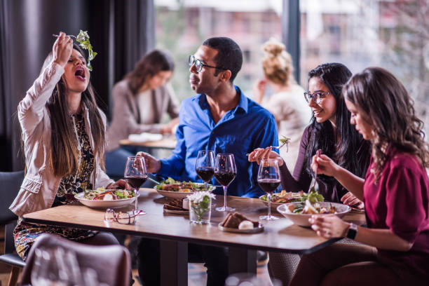 istock Friends eating in modern restaurant. 1139047604