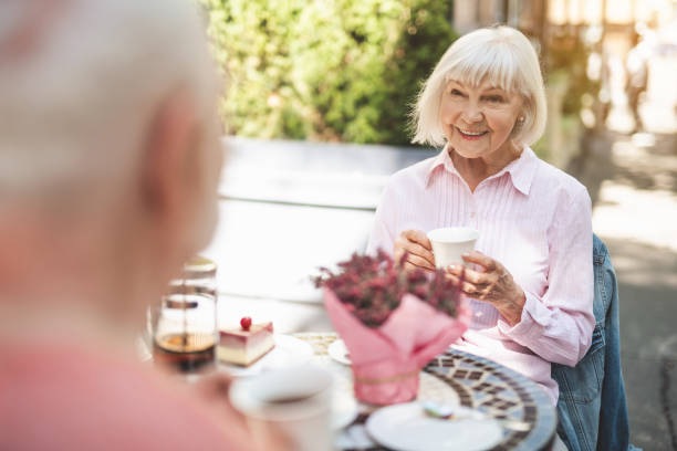 istock Happy senior couple drinking tea outside 1139049312
