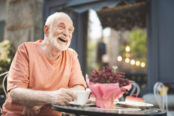 istock Joyful old man laughing in delight outside 1139049334