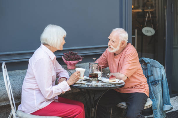 istock Mature couple communicating in cafe outside 1139049419