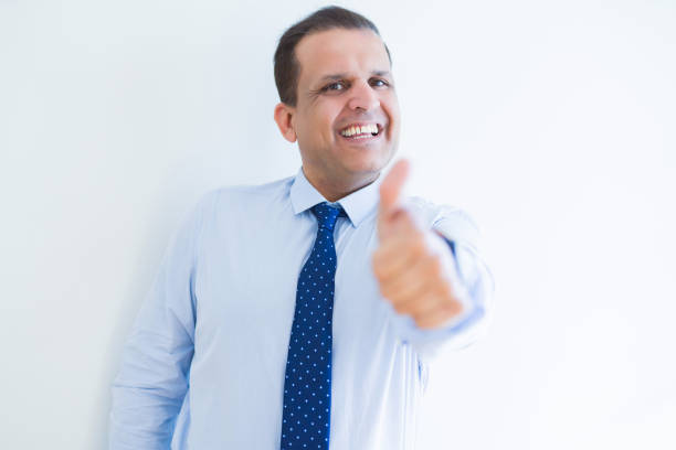 istock Middle age man doing postive gesture with thumbs up smiling to the camera 1139051466