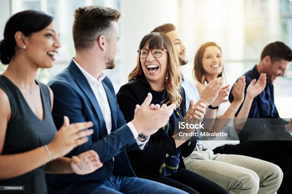 Inspire your teams to keep on achieving Shot of a group of businesspeople applauding during a seminar Happiness Stock Photo
