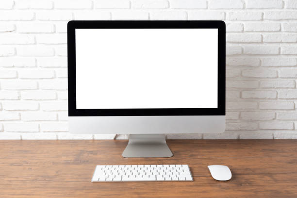 istock workspace with computer with blank white screen, and office supplies on a wooden desk 1139055056