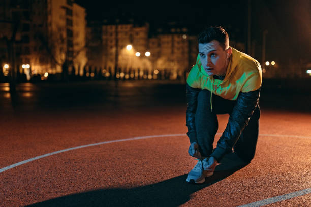 istock Athletic man tying shoelace 1139056208