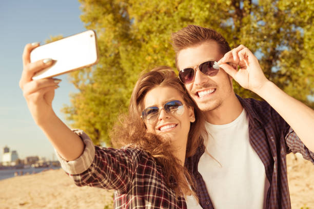 istock Young couple making selfie photo 1139056349