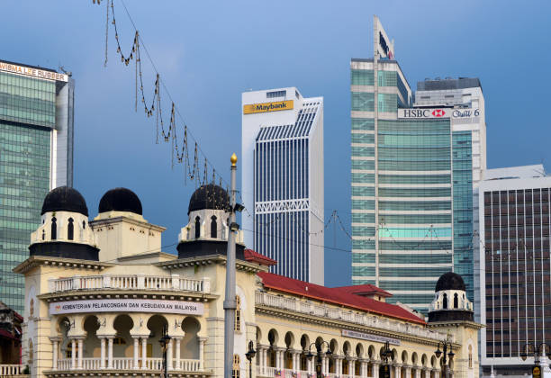 Kuala Lumpur, Malaysia: Old High Courts - Moorish inspired colonial architecture on Merdeka Square - designed by A.B. Hubback, the British architect who designed most of the heritage buildings in Malaysia with Moorish (Mughul) architecture - completed in 1915. In the background: Wisma Lee Rubber, Maybank and HSBC towers.