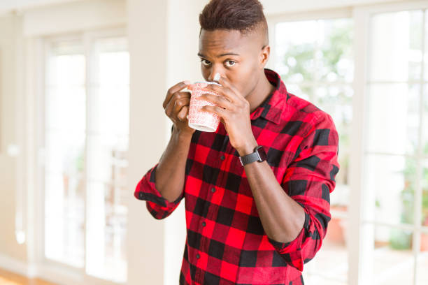 istock Young african american man drinking a cup of coffee 1139062058