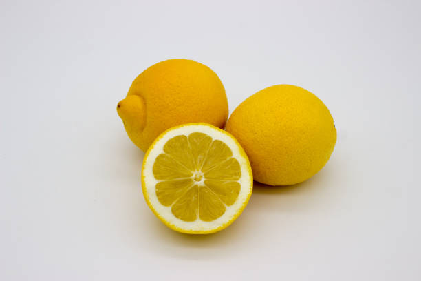 istock Two lemons and a half of a lemon isolated image on a white background 1139064304