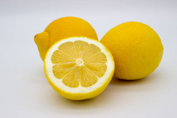 istock Two lemons and a half of a lemon isolated image on a white background 1139064420