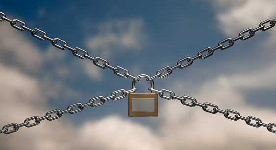Padlock and Chain Isolated on Cloudy Sky Background With Clipping Path