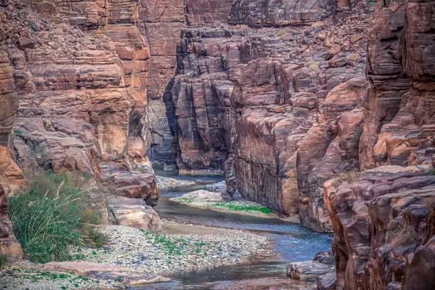 incredibly impressive and beautiful canyon with rocky cliffs in the national park of Jordan Wadi Mujib