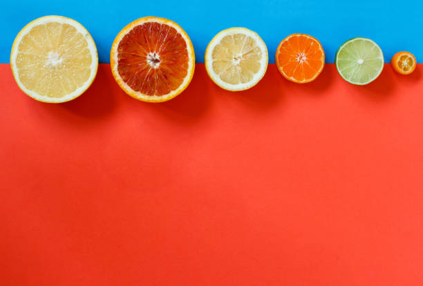 istock Citrus fruits on a red, and blue background 1139067929
