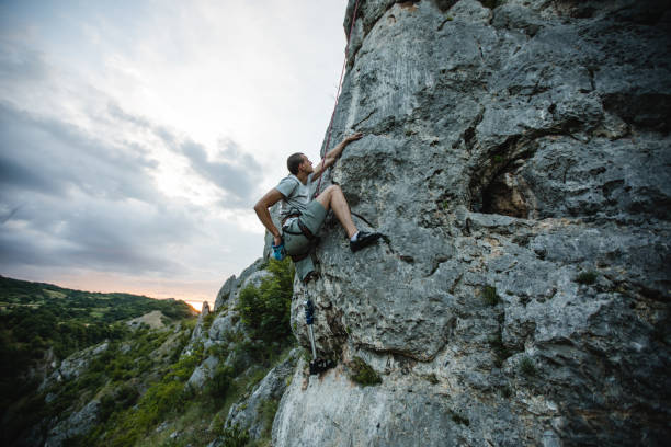 istock Adaptive athlete free rock climbing 1139068656