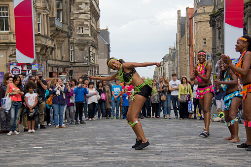 Unidentified group of black dancers perform on the street at the Edinburgh Festival Fringe in Edinburgh, UK on August 2, 2012